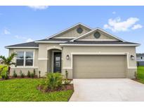 Charming single-story home with a two-car garage, landscaped front yard, and neutral color palette at 1864 Maple Plum Ct, Sanford, FL 32771