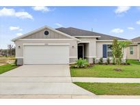 Charming one-story home featuring a two-car garage, well-manicured lawn, and inviting curb appeal at 2664 Hancock Crossing Dr, Bartow, FL 33830