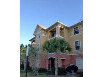 Building exterior featuring attractive architectural details and landscaping at 3700 Castle Pines Ln # 4032, Orlando, FL 32839