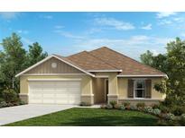 Inviting single-story home with a well-manicured lawn, attached two-car garage, and neutral exterior at 5571 Creek Haven Way, Lakeland, FL 33810