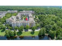 Apartment building near lake, highlighted in red at 1211 Stonecutter Dr # 206, Celebration, FL 34747
