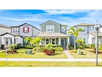 Two-story Craftsman style home with gray siding, landscaping, and a brick walkway at 12754 Brodlove Ln, Winter Garden, FL 34787