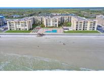 Aerial view of beachfront condo building with pool and ocean views at 4175 S Atlantic Ave # 4070, New Smyrna Beach, FL 32169