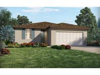 One-story home with a brown roof, attached garage, and landscaped yard at 3829 Giorgio Dr, Winter Haven, FL 33884