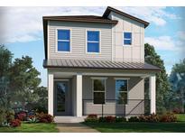 Two-story modern home with gray siding, metal roof, and a small porch at 5112 Railroad Vine Aly, Winter Garden, FL 34787