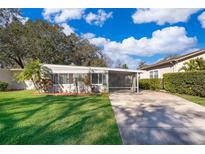 Ranch style home with carport and mature landscaping at 5416 Parkway Dr, Belle Isle, FL 32809