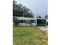 Ranch style home with a spacious lawn and driveway at 5416 Parkway Dr, Belle Isle, FL 32809