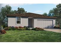 One-story home with gray siding, brown roof, and landscaped yard at 2361 White Tail St, Davenport, FL 33837