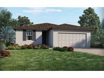 One-story home with a two-car garage and landscaped lawn at 3555 Broadwing Blvd, Poinciana, FL 34759