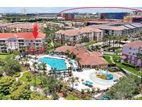 Aerial view of a resort-style community with a pool, clubhouse, and splashpad at 5012 Shoreway Loop # 10207, Orlando, FL 32819