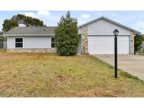 Charming single story home with stone accents and a spacious yard at 1062 Blue Horizon Dr, Deltona, FL 32725