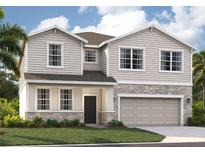 Two-story house with stone accents and a two-car garage at 33339 Seattle Slew Dr, Sorrento, FL 32776