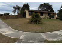 Single story home with a well-maintained lawn and wooden fence at 359 Prevo Dr, Apopka, FL 32712