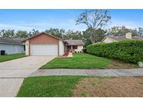 Charming single-story home with attached garage and well-maintained front yard at 654 Boniview Ln, Altamonte Springs, FL 32714