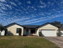 Charming ranch-style home with brick facade and updated landscaping at 1003 Beckstrom Dr, Oviedo, FL 32765