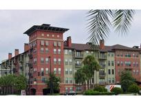 Attractive multi-story building with balconies and palm trees at 911 N Orange Ave # 127, Orlando, FL 32801