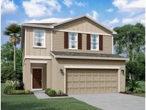 Two-story house with beige siding, brown accents, and a two-car garage at 1457 Dalkeith Cv, Sanford, FL 32771