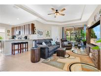 Open concept living area with comfortable seating and kitchen views at 161 Old Moss Cir, Deland, FL 32724