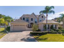 Charming two-story home with a three car garage and a beautifully paved driveway at 14039 Hampshire Bay Cir, Winter Garden, FL 34787