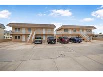 Front view of two-unit building, ample parking at 3724 S Atlantic Ave # 20, Daytona Beach, FL 32118