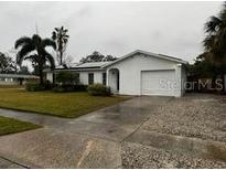 Single-story home with a large yard and attached garage at 102 Aberdeen Dr, Fern Park, FL 32730