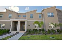 Modern two-story townhome with attractive landscaping at 2952 Protagonist St, Kissimmee, FL 34746