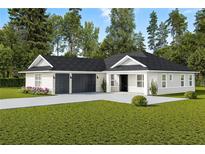 Newly constructed home with a two-car garage and manicured lawn at Tbd Sw 93 St, Dunnellon, FL 34432