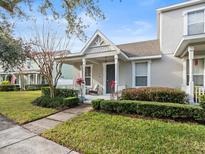 Charming house exterior with a front porch and well-manicured landscaping at 14624 Clarkson Dr, Orlando, FL 32828