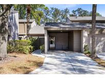 Exterior view of condo with carport and landscaped grounds at 513 Goodridge Ln, Fern Park, FL 32730