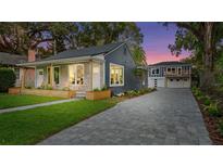 Charming craftsman home with gray paver driveway and landscaped yard at 806 Palmer St, Orlando, FL 32801