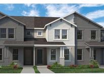 Two-story townhome with gray and white exterior at 13552 Autumn Harvest Ave, Winter Garden, FL 34787