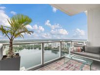 Spacious balcony with city and lake views, seating area, and modern decor at 150 E Robinson St # 3107, Orlando, FL 32801