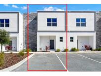 Modern two-story townhome with stone and white exterior at 368 Famagusta Dr, Davenport, FL 33896