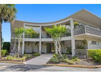 Curved building exterior with landscaping and walkway at 700 Melrose Ave # A 22, Winter Park, FL 32789