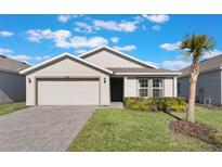 One-story home with a two-car garage and landscaped front yard at 2025 Havasu Falls Ave, Deland, FL 32724