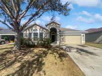 One-story house with a garage and manicured lawn at 161 Pinefield Dr, Sanford, FL 32771