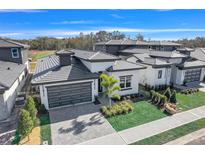 Aerial view of a house and surrounding community at 3032 Kensington Ave, Davenport, FL 33837