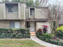 Charming townhome featuring a welcoming entrance and vibrant landscaping at 473 Oak Haven Dr # 473, Altamonte Springs, FL 32701