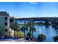 Stunning lake view with lush landscaping and a fountain at 3250 Corona Village Way # 302, Orlando, FL 32835