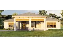 Front view of a single-story house with a covered entryway and landscaped lawn at 4320 Bancroft Blvd, Orlando, FL 32833