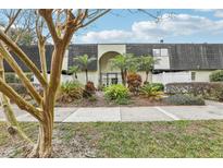 Inviting condo building exterior with lush landscaping and gated entrance at 1120 Portland Ave # 4, Orlando, FL 32803