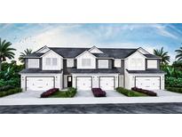 Three-unit townhome building with white and gray exterior, attached garages, and landscaping at 1545 Heritage Pl, Oviedo, FL 32765