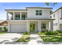 Two-story modern home with attached garage and landscaped front yard at 2315 Depauw Ave, Orlando, FL 32804