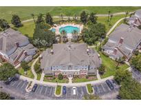 Luxury condo community with resort-style pool and golf course views at 7609 Heritage Crossing Way # 201, Reunion, FL 34747
