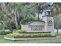 Pennbrooke Fairways community entrance sign with landscaping at 228 Westwood Dr, Leesburg, FL 34748