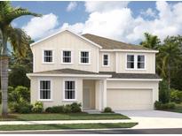 Two-story house with beige siding, gray roof, and a two-car garage at 5748 Haystack Dr, St Cloud, FL 34771