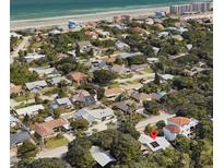 Aerial view showing home's location near the beach and other houses at 4714 S Peninsula Dr, Ponce Inlet, FL 32127