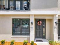 Inviting exterior with private entrance and landscaping at 12964 Brandon Coates Dr, Orlando, FL 32828