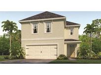 Two-story house with beige exterior, two-car garage, and landscaping at 3146 Partington Blvd, Davenport, FL 33837