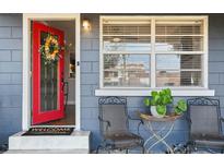 Inviting front door entrance with red door and welcoming mat at 128 Tildenville School Rd, Winter Garden, FL 34787